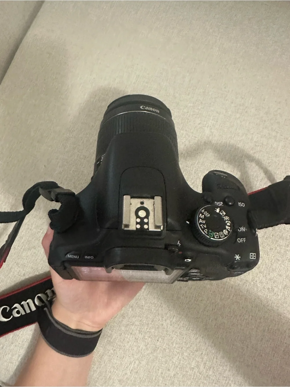 Canon DSLR Camera in Black with Red-Trim Strap